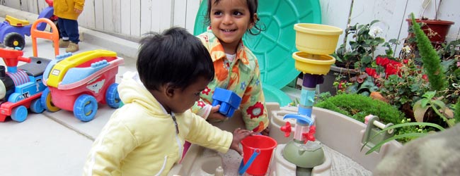 Children playing at the sand box area